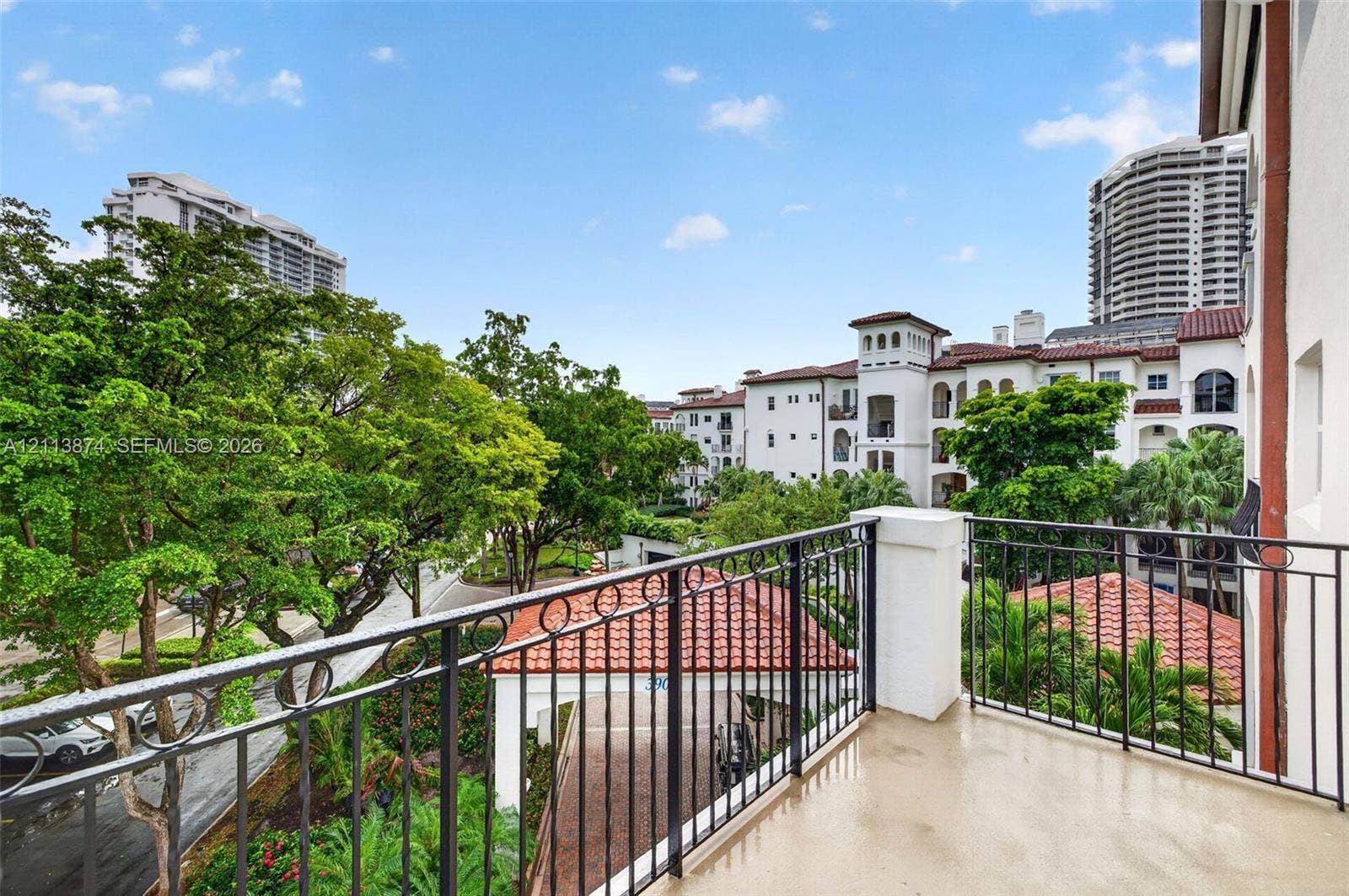 3900 Island Boulevard, #B408, Aventura, Aventura, FL 33160 Private balcony featuring metal railings, smooth-finish flooring, and a terra cotta tile roof structure