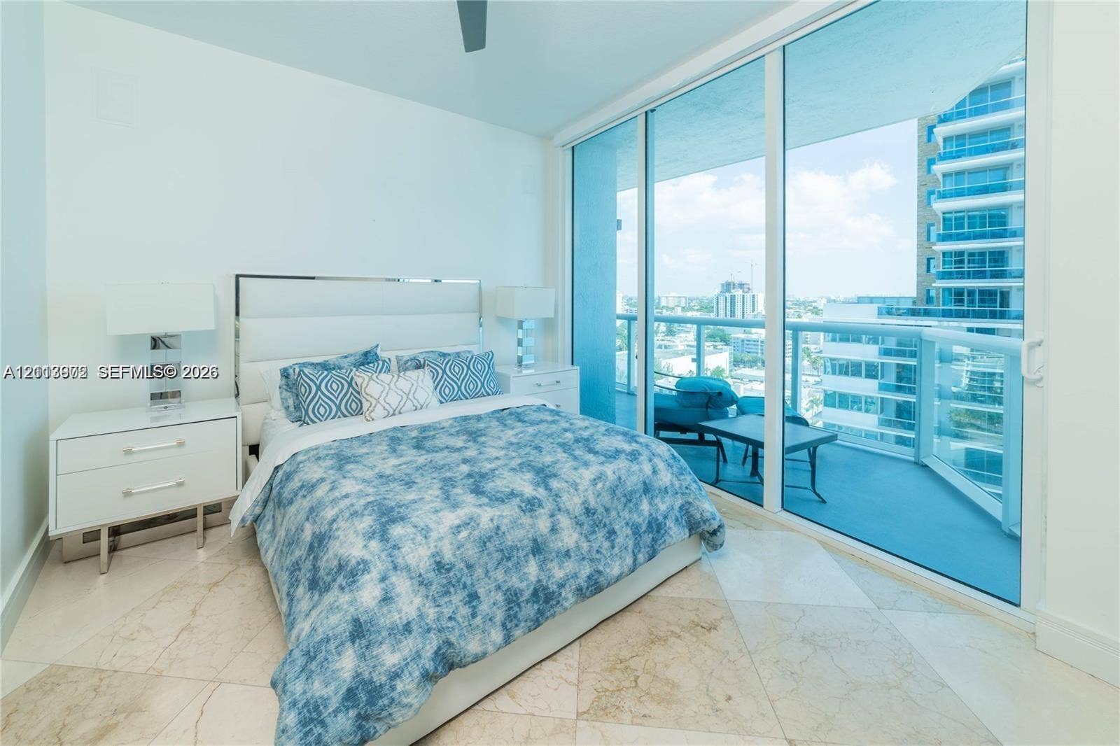 6515 Collins Avenue, #1609, Miami Beach, Miami Beach, FL 33141 Floor-to-ceiling sliding glass doors, private balcony with glass railing, and polished stone tile flooring