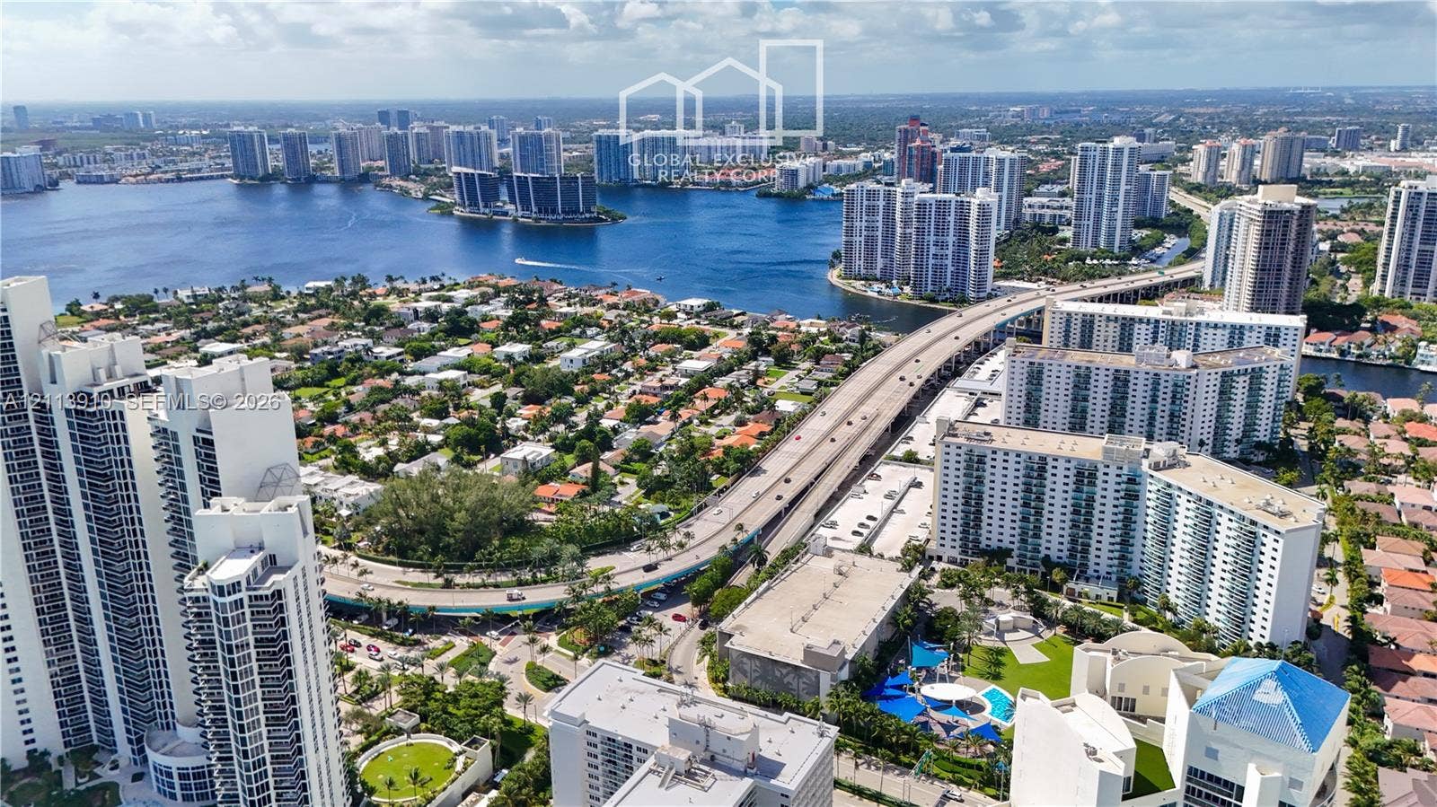 19380 Collins Avenue, #218, Sunny Isles Beach, FL 33160 Aerial perspective showcasing waterfront proximity, coastal high-rise architecture, and expansive urban density
