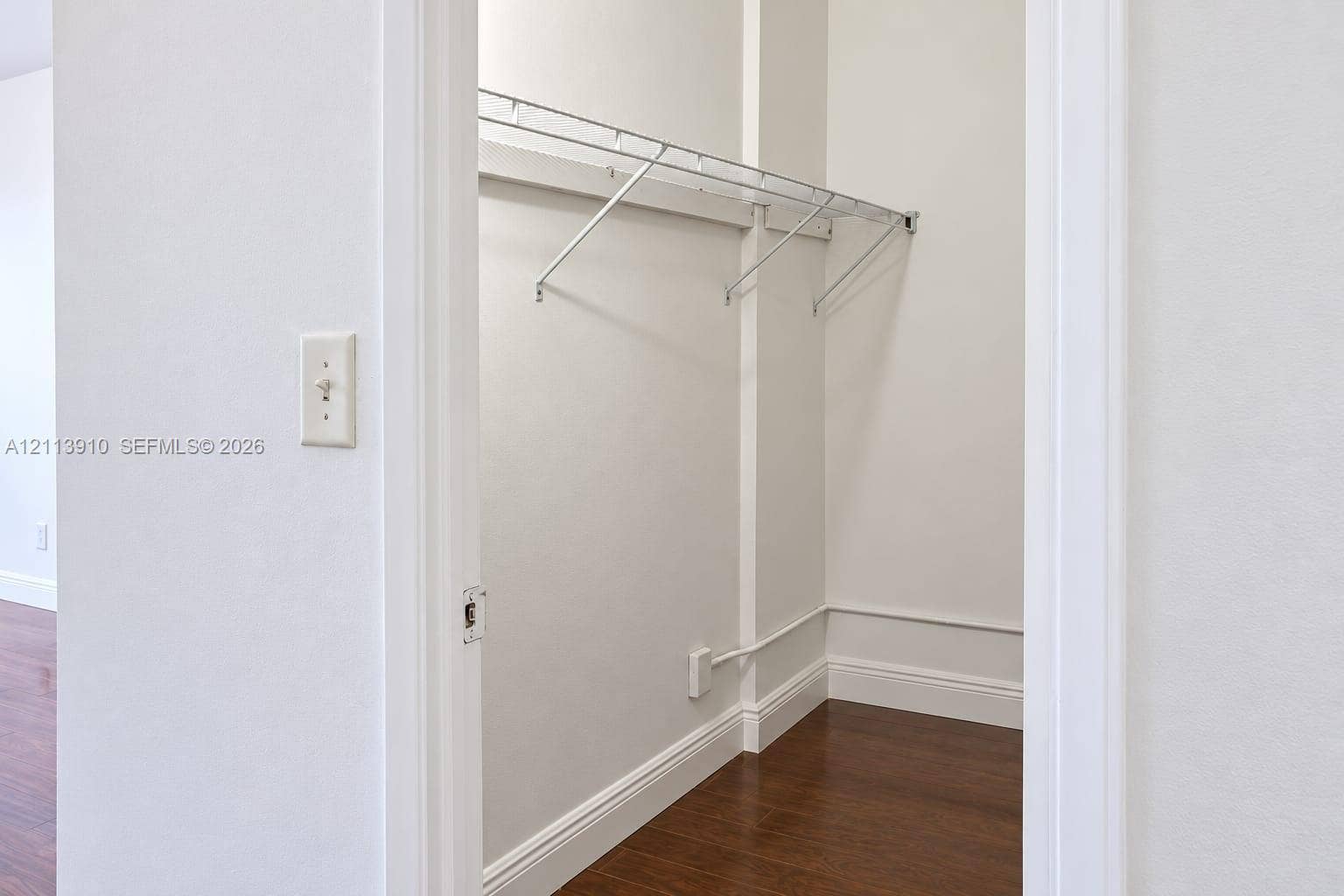 19380 Collins Avenue, #218, Sunny Isles Beach, FL 33160 Storage closet featuring wood-finish flooring and integrated metal shelving