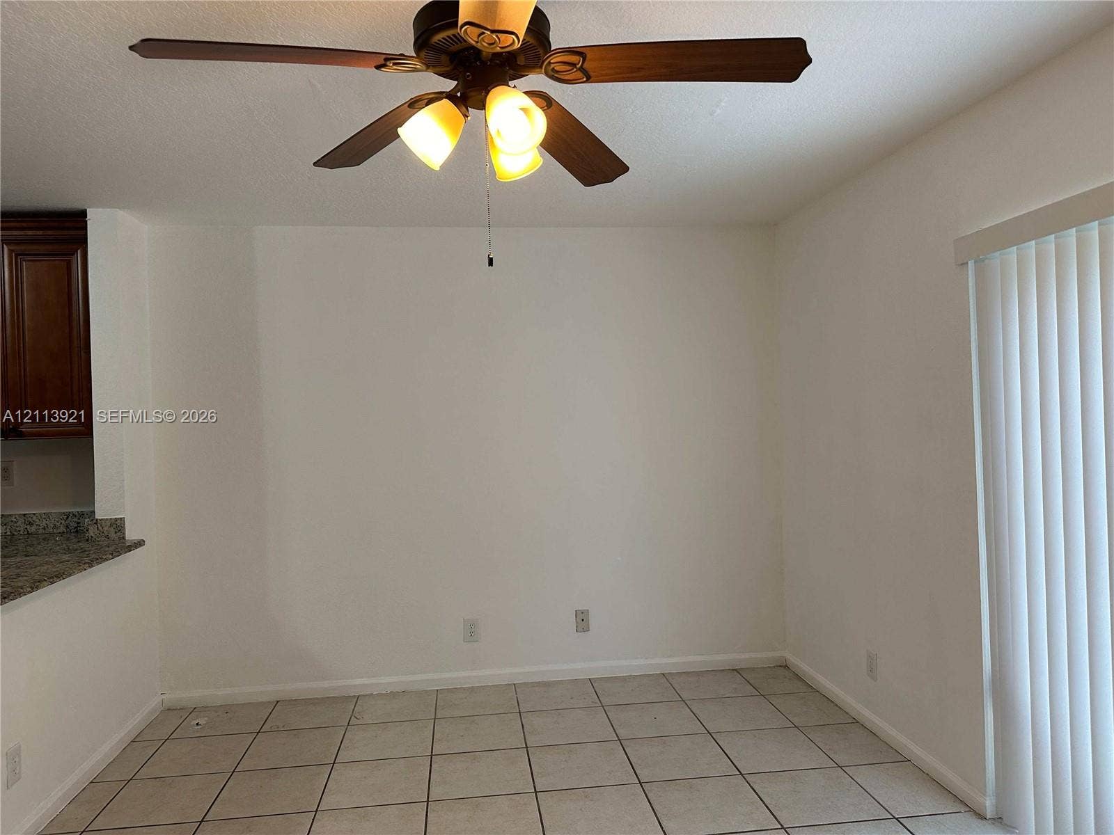 824 Summit Lake Drive, West Palm Beach, West Palm Beach, FL 33406 Tile flooring, ceiling fan with integrated light fixture, and vertical window blinds
