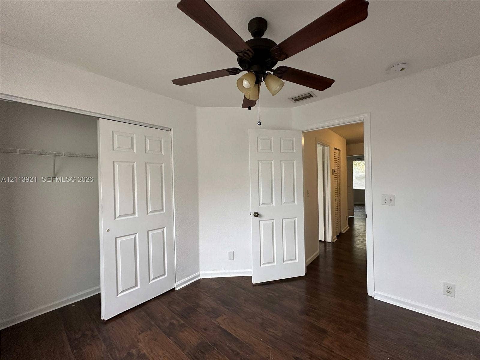 824 Summit Lake Drive, West Palm Beach, West Palm Beach, FL 33406 Wood-finish flooring, ceiling fan with integrated lighting, and multi-panel interior doors