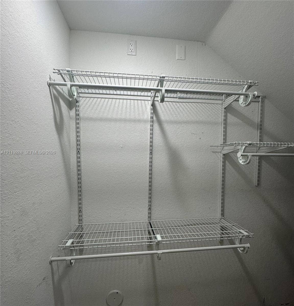 14569 SW 261st Terrace, #14569, Homestead, Homestead, FL 33032 Walk-in storage space featuring adjustable white wire shelving and dual hanging rods