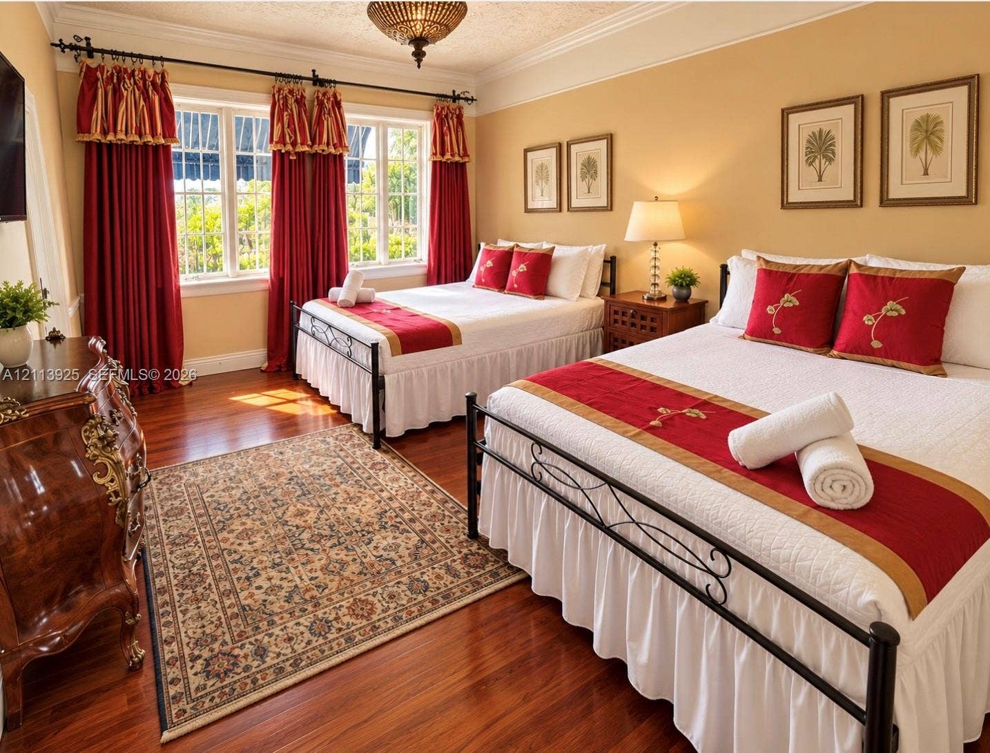 1055 Hollywood Boulevard, Hollywood, Hollywood, FL 33019 Room featuring wood-finish flooring, crown molding, multi-pane windows, and a decorative ceiling-mounted light fixture