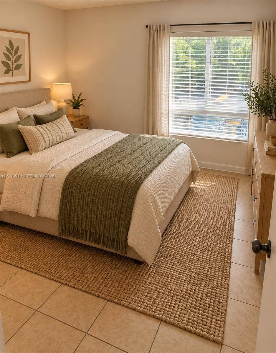 11150 SW 196th Street, #D211, Cutler Bay, Cutler Bay, FL 33157 Neutral-toned tile flooring, large window with horizontal blinds, and neutral wall color