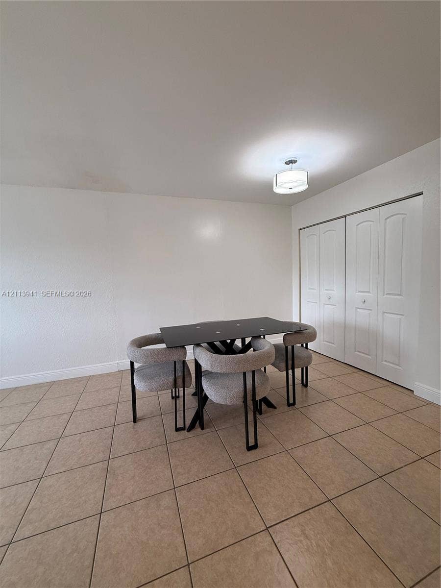 17255 SW 95th Avenue, #457, Palmetto Bay, Palmetto Bay, FL 33157 Ceramic tile flooring, double-panel closet doors, and drum-style ceiling light fixture