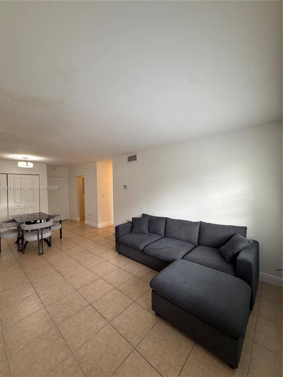 17255 SW 95th Avenue, #457, Palmetto Bay, Palmetto Bay, FL 33157 Neutral-toned tile flooring, recessed ceiling light fixture, and closet with double-panel doors