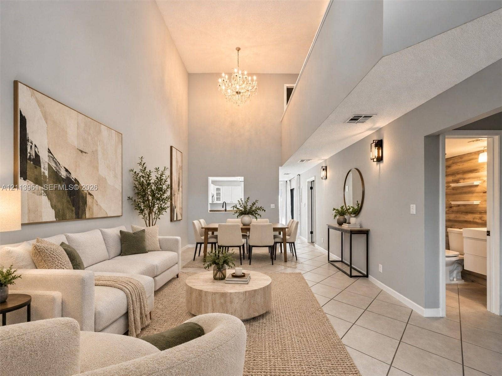 339 City View Drive, #339, Fort Lauderdale, Fort Lauderdale, FL 33311 Two-story vaulted ceilings featuring a crystal chandelier and tile flooring