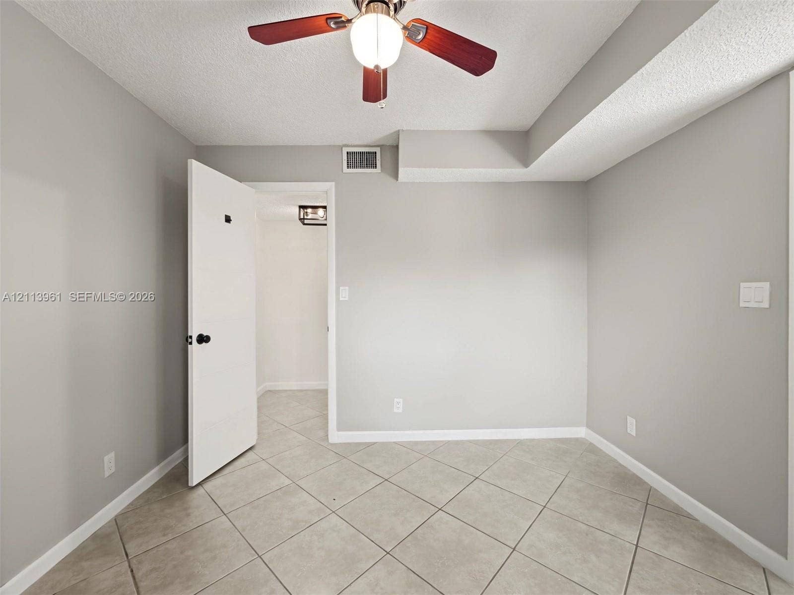 339 City View Drive, #339, Fort Lauderdale, Fort Lauderdale, FL 33311 Room featuring neutral wall paint, diagonal-set ceramic tile flooring, and a ceiling fan with integrated lighting