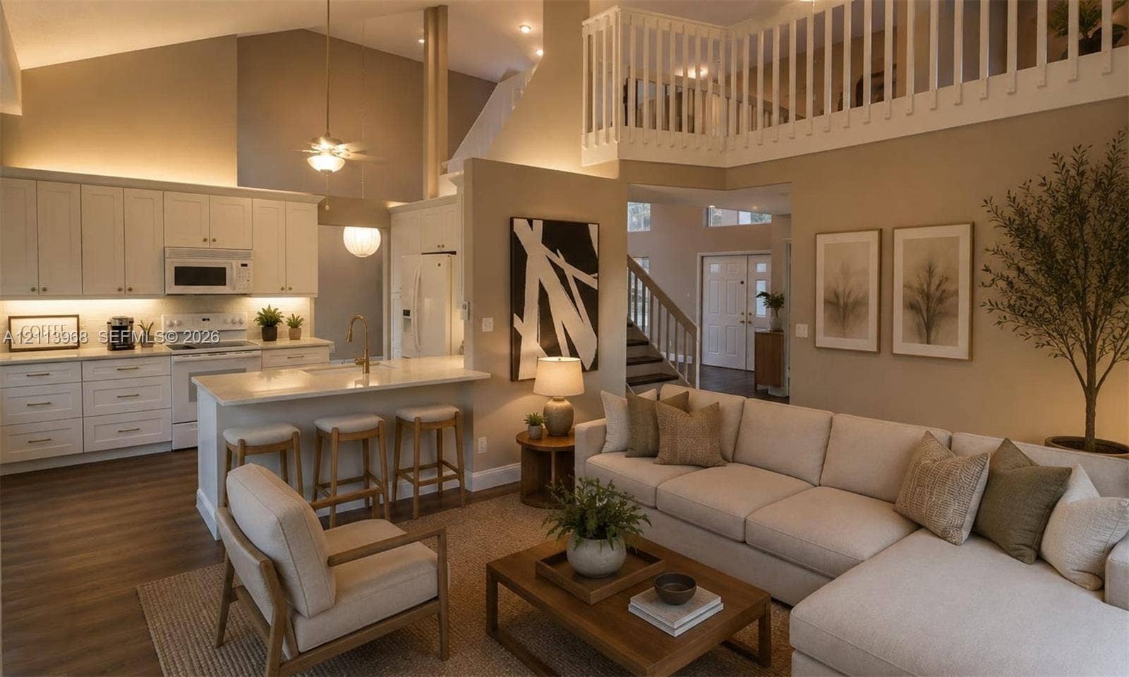 Vaulted ceilings with recessed lighting, kitchen featuring white shaker-style cabinetry, breakfast bar with stone-surfaced countertop, wood-finish flooring, and open loft overlook with white railing
