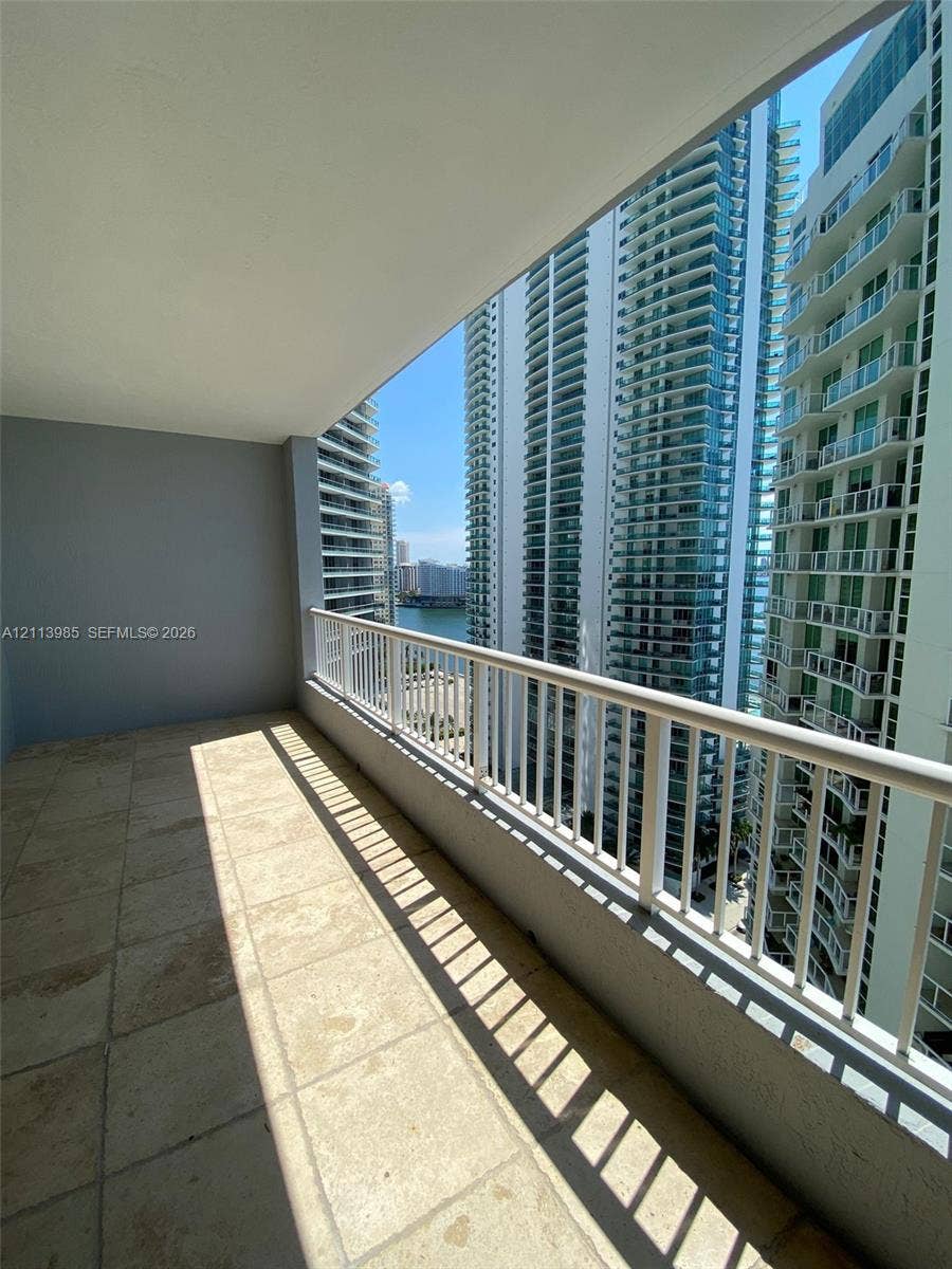 170 SE 14th Street, #2203, Miami, Miami, FL 33131 Covered balcony featuring stone-finish flooring and a white metal railing