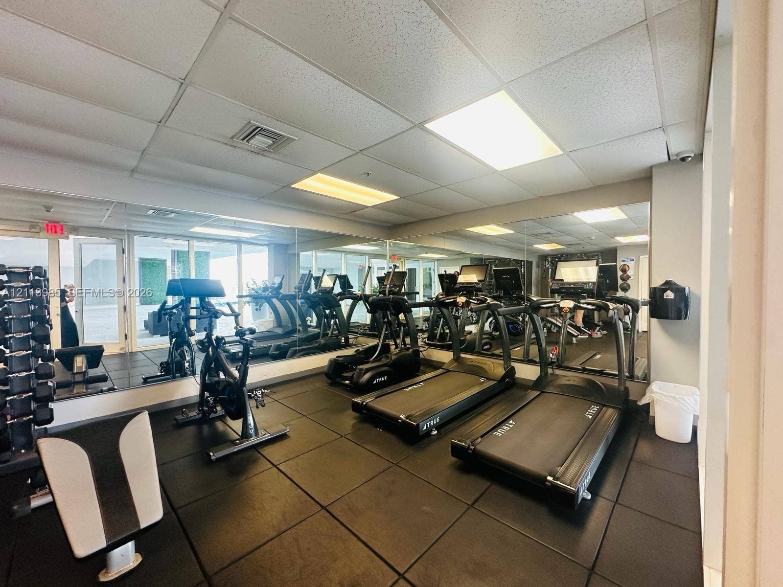 170 SE 14th Street, #2203, Miami, Miami, FL 33131 Fitness center featuring rubber flooring, floor-to-ceiling mirrored walls, and recessed lighting