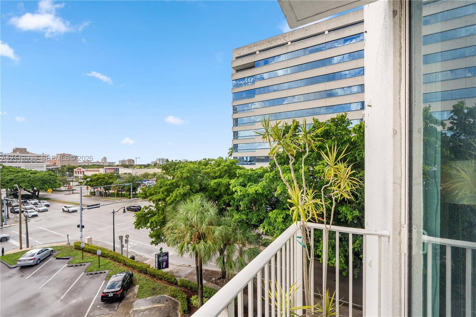 3180 SW 22nd Terrace, #407, Miami, Miami, FL 33145 Outdoor balcony featuring a white metal railing and sliding glass door