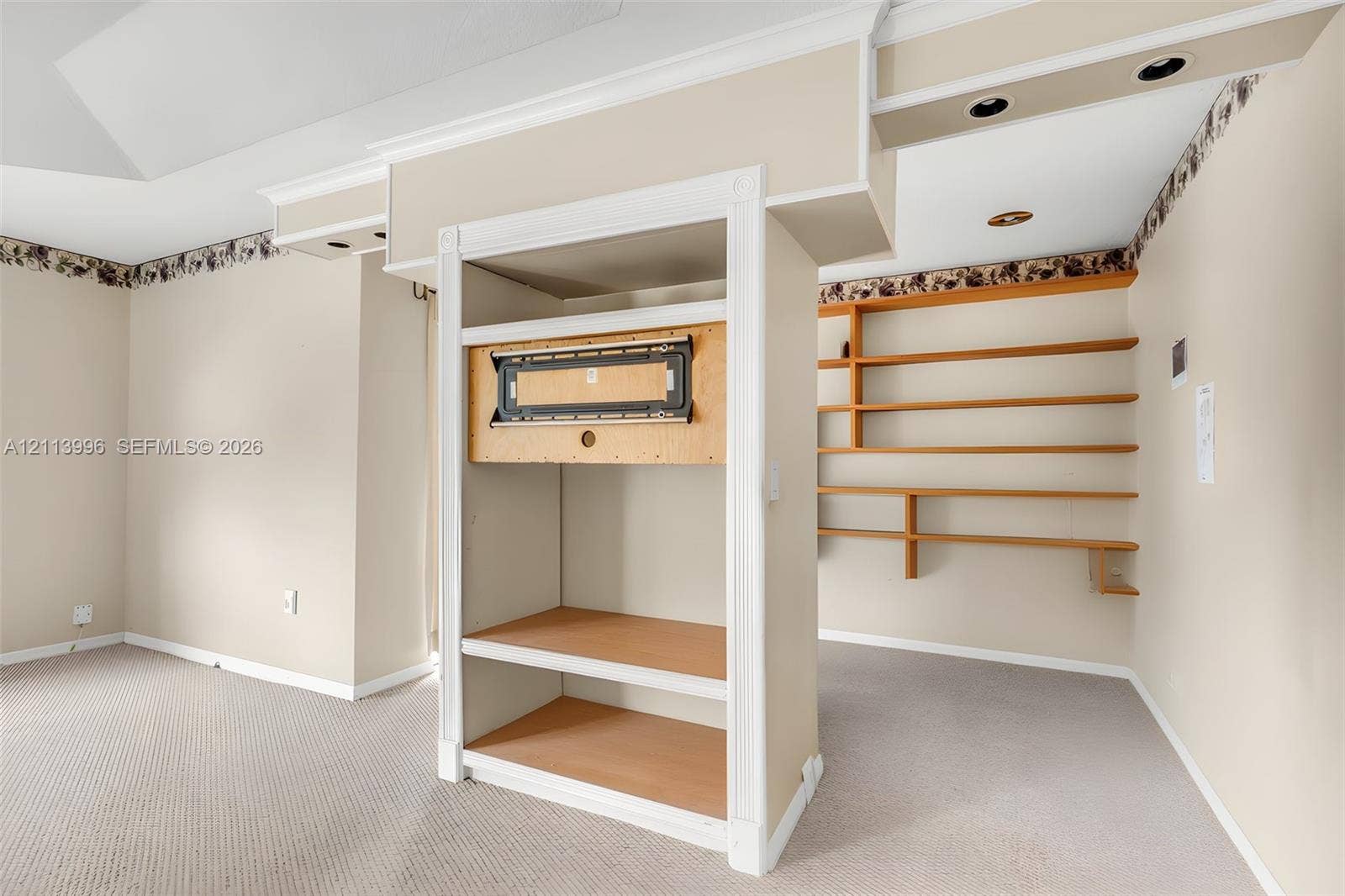 15503 SW 19th Street, Miramar, FL 33027 Built-in cabinetry with integrated media mount, recessed ceiling lighting, and wall-mounted shelving