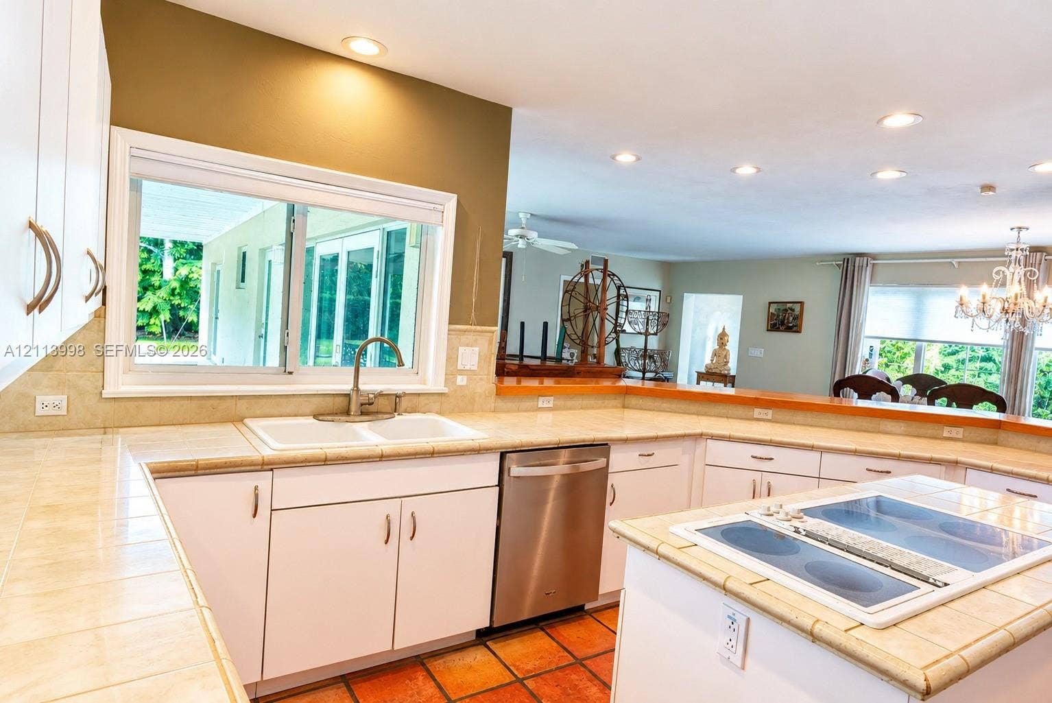 16455 SW 91st Avenue, Palmetto Bay, FL 33157 Kitchen featuring white cabinetry, tile countertops, recessed lighting, a stainless steel dishwasher, and a built-in cooktop