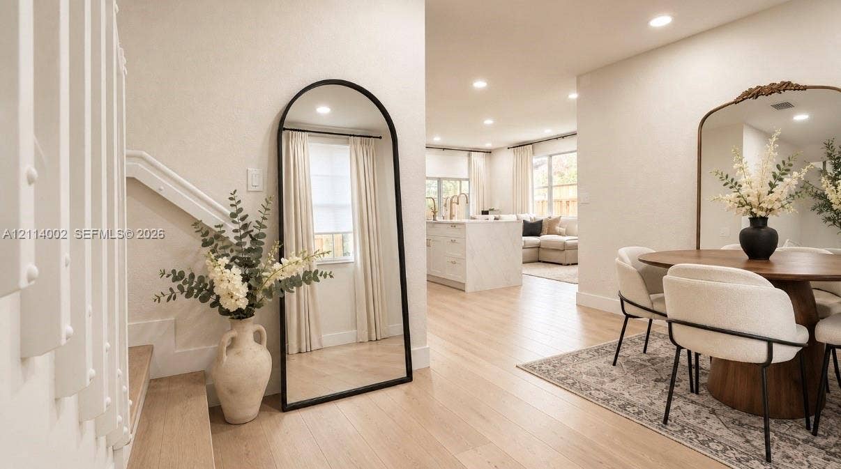 1495 NE 33rd Avenue, #107, Homestead, Homestead, FL 33033 Open floor plan featuring wood-finish flooring, recessed lighting, and a central island with stone-finish waterfall countertop