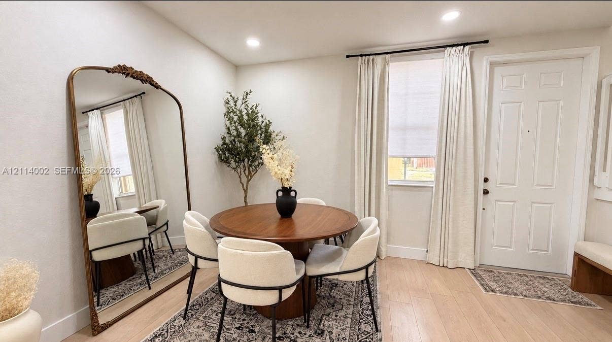 1495 NE 33rd Avenue, #107, Homestead, Homestead, FL 33033 Neutral interior space featuring wood-finish flooring, recessed lighting, and a multi-panel exterior entry door