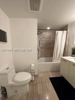 1300 Brickell Bay Drive, #1000, Miami, Miami, FL 33131 Bathroom featuring a vanity with integrated sink, porcelain tile flooring, and a shower-tub combination with horizontal wall tiling