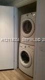 1300 Brickell Bay Drive, #1000, Miami, Miami, FL 33131 Stacked white laundry unit housed in a dedicated closet
