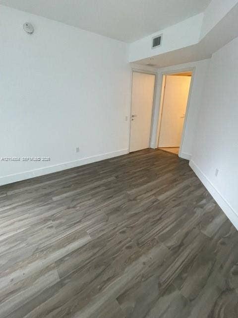 1300 Brickell Bay Drive, #1000, Miami, Miami, FL 33131 Wood-finish flooring, neutral walls, and solid-core interior doors