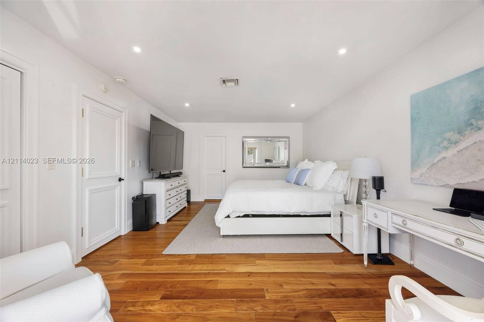 Bedroom featuring wood-finish flooring and recessed lighting