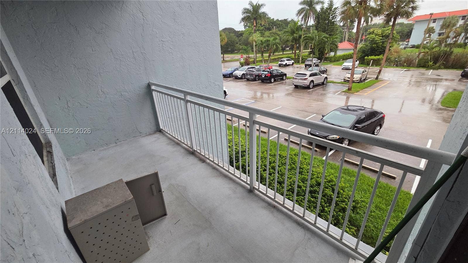 505 S Pine Island Road, #B205, Plantation, FL 33324 Private balcony featuring concrete flooring, a metal railing, and an integrated exterior storage closet