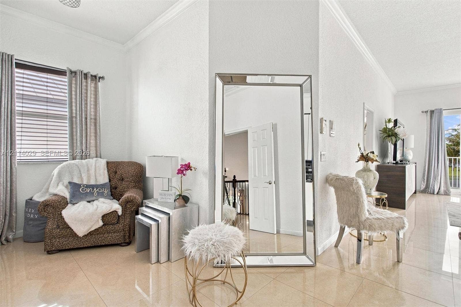 5257 SW 158th Avenue, Miramar, FL 33027 Large format tile flooring, crown molding, and horizontal slat window blinds