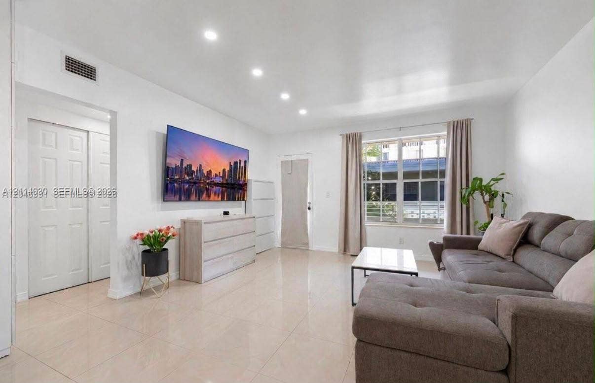 8550 Byron Avenue, #2H, Miami Beach, FL 33141 Neutral-toned tile flooring, recessed ceiling lighting, and multi-pane window
