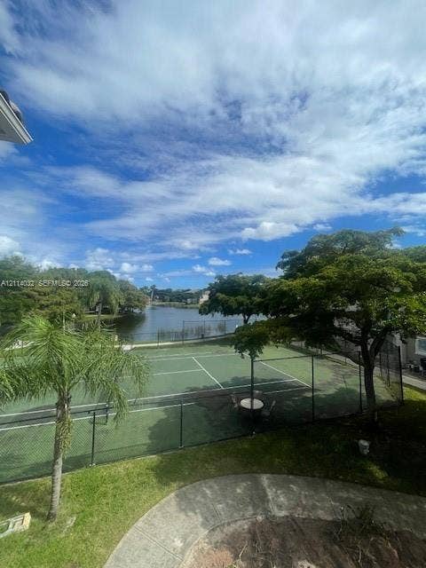 4177 N Haverhill Road, #821, West Palm Beach, West Palm Beach, FL 33417 Fenced tennis court, water frontage, and mature trees situated on the property grounds