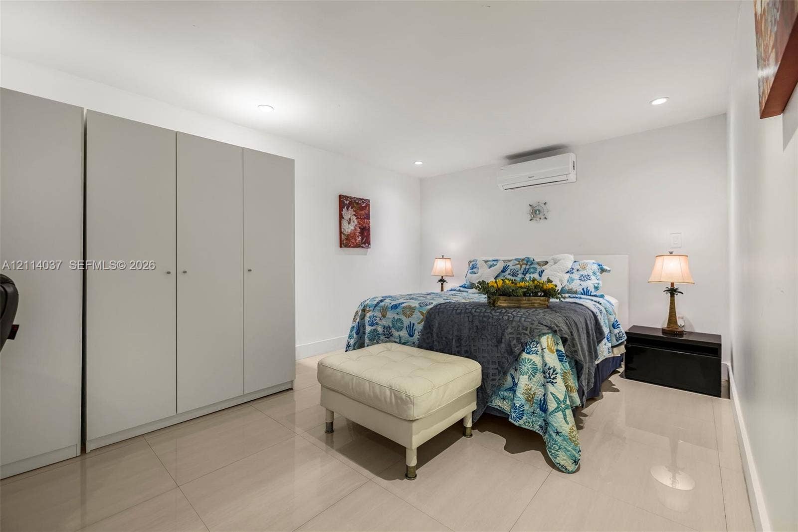 8436 SW 143rd Avenue, Miami, FL 33183 Neutral-tone ceramic tile flooring, floor-to-ceiling built-in cabinetry, recessed ceiling lighting, and wall-mounted ductless climate control unit