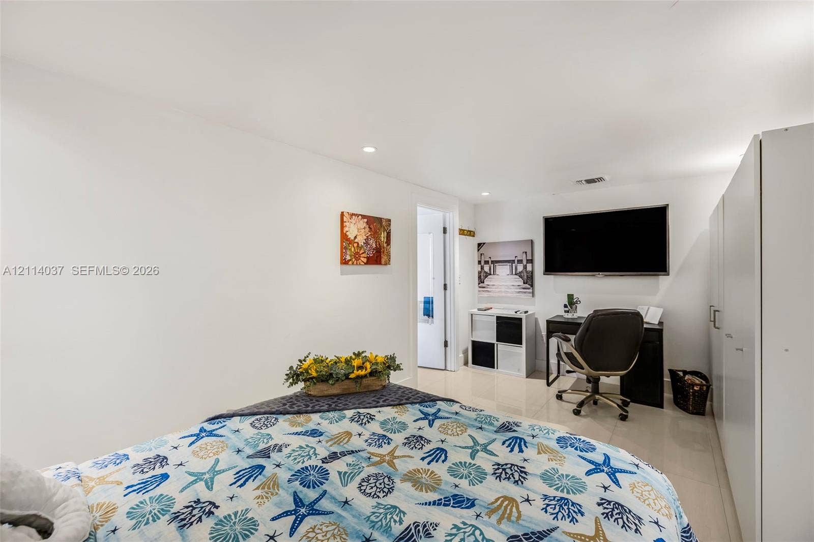 8436 SW 143rd Avenue, Miami, FL 33183 Bright room featuring recessed lighting, polished tile flooring, and integrated white cabinetry