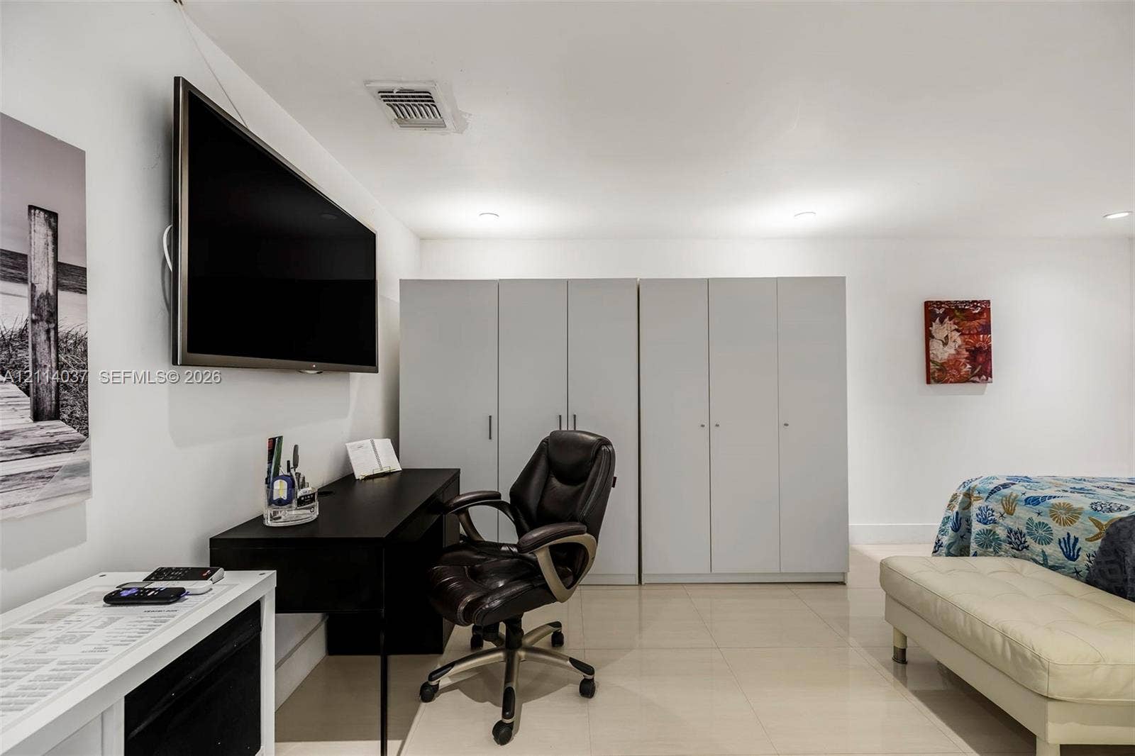 8436 SW 143rd Avenue, Miami, FL 33183 Built-in floor-to-ceiling cabinetry, recessed lighting, and large-format tile flooring