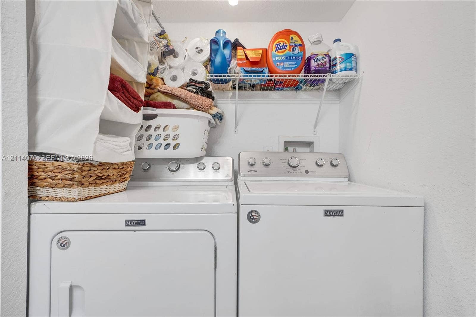 15400 SW 284th Street, #1204, Homestead, Homestead, FL 33033 Laundry alcove featuring white appliance hookups and wire shelving