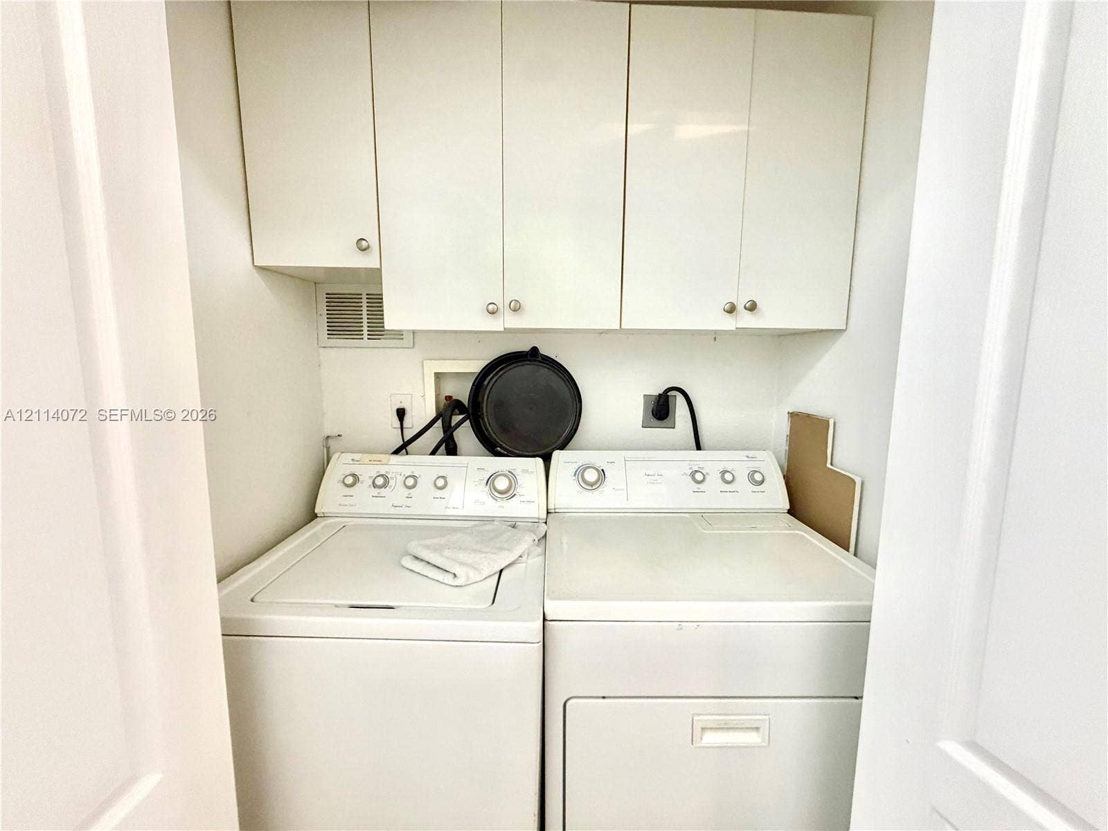8964 W Flagler Street, #107, Miami, Miami, FL 33174 Laundry area featuring white flat-panel upper cabinetry and recessed hookups