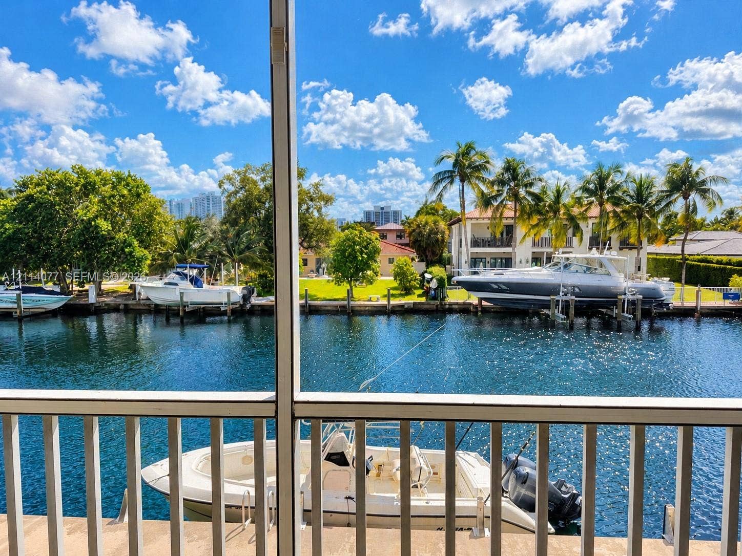 465 Paradise Isle Boulevard, #206, Hallandale Beach, Hallandale Beach, FL 33009 Screened enclosure featuring a concrete bulkhead, private boat slip, and direct waterway access