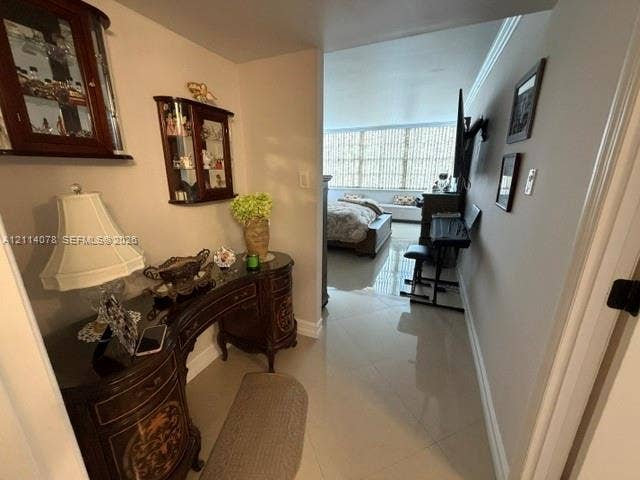 Polished tile flooring and large-pane windows providing natural light