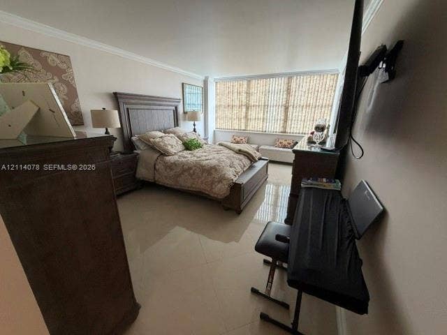Large-format tile flooring, crown molding, and floor-to-ceiling windows featuring vertical blinds