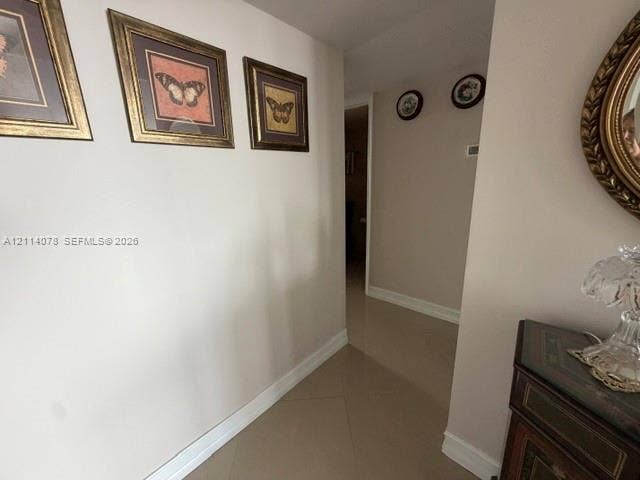 Neutral wall palette and large-format tile flooring