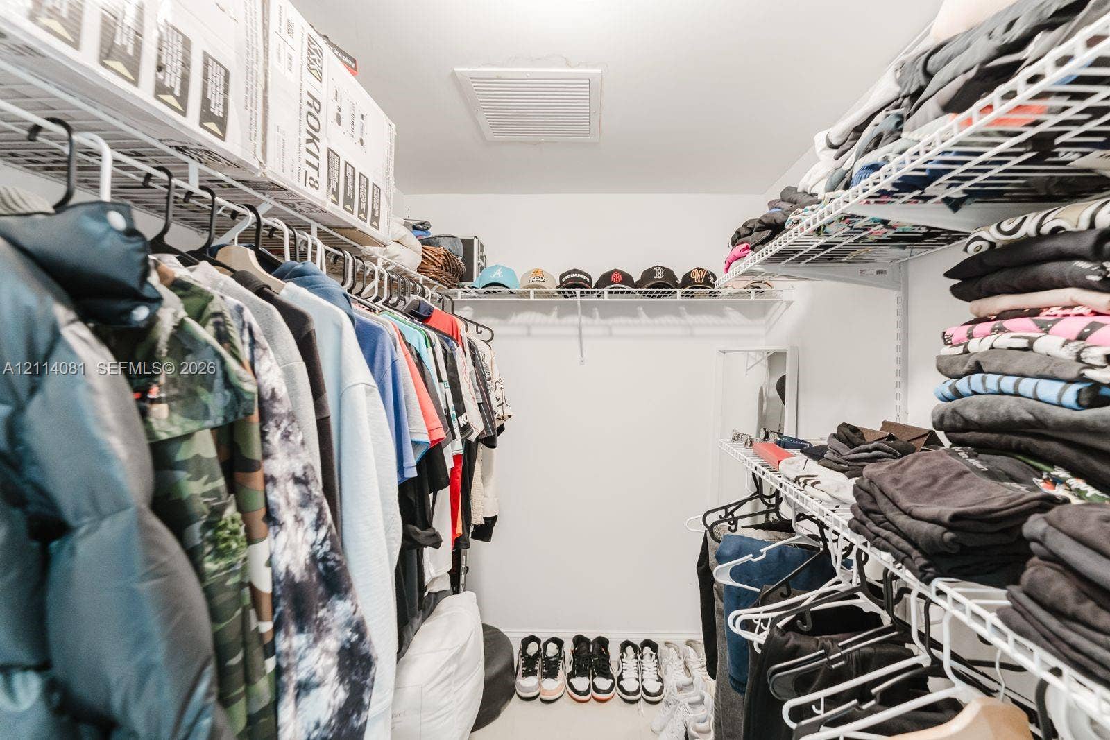 185 SW 7th Street, #3609, Miami, Miami, FL 33130 Walk-in closet featuring tiered white wire shelving and a multi-level storage configuration