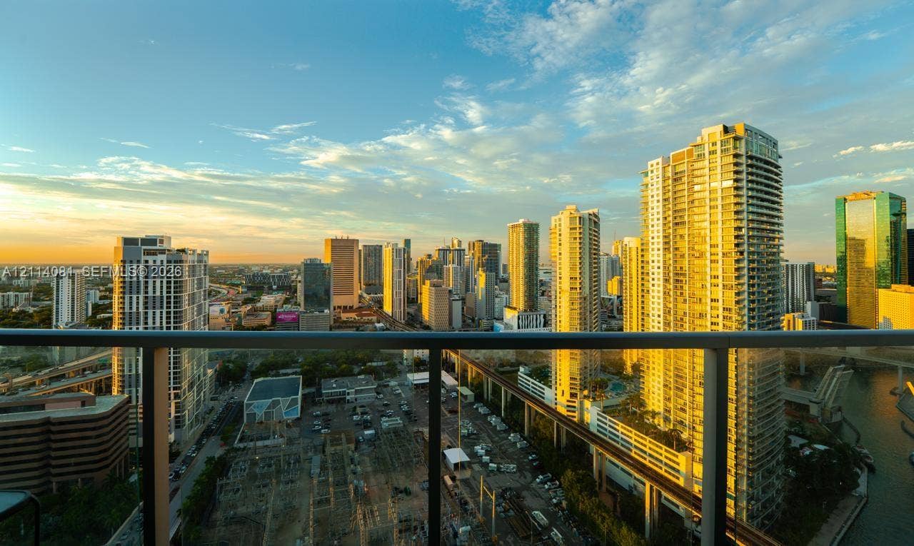 185 SW 7th Street, #3609, Miami, Miami, FL 33130 Elevated balcony featuring a matte black metal railing and expansive urban skyline scenery