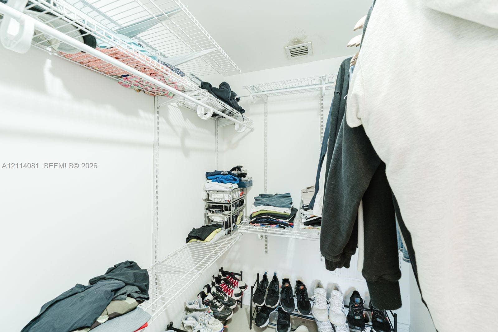 185 SW 7th Street, #3609, Miami, Miami, FL 33130 Walk-in storage space featuring white wire shelving units and integrated wall-mounted tracks