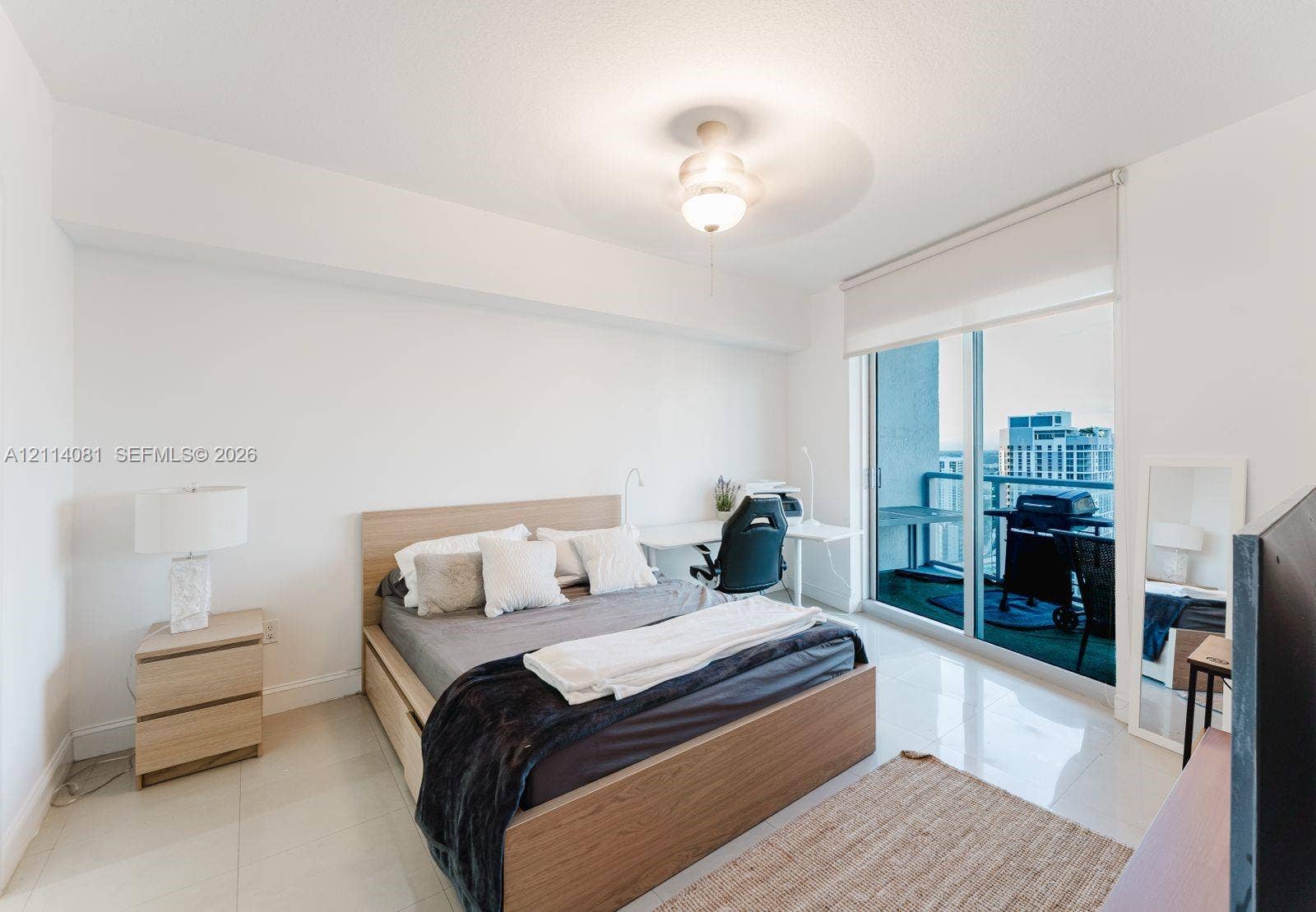 185 SW 7th Street, #3609, Miami, Miami, FL 33130 Polished tile flooring, neutral wall finishes, flush-mount ceiling lighting, and floor-to-ceiling glass sliding doors providing access to a private balcony