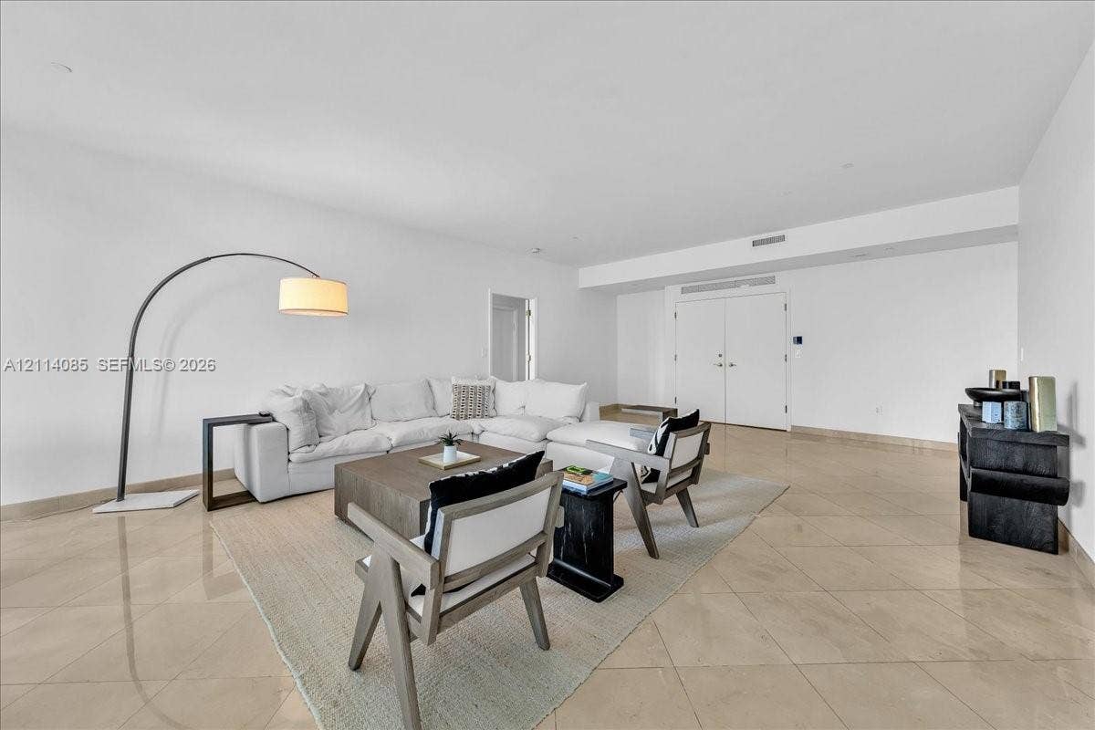 10101 Collins Avenue, #8D, Bal Harbour, FL 33154 Spacious interior featuring large-format tile flooring, recessed ceiling lighting, and double-entry doors