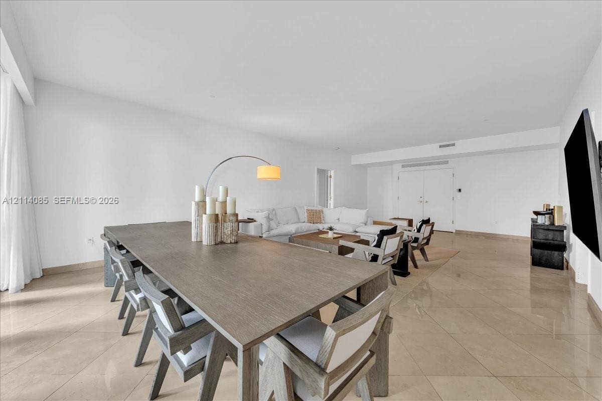 10101 Collins Avenue, #8D, Bal Harbour, FL 33154 Open-concept interior featuring large-format tile flooring, smooth wall finishes, and recessed ceiling lighting