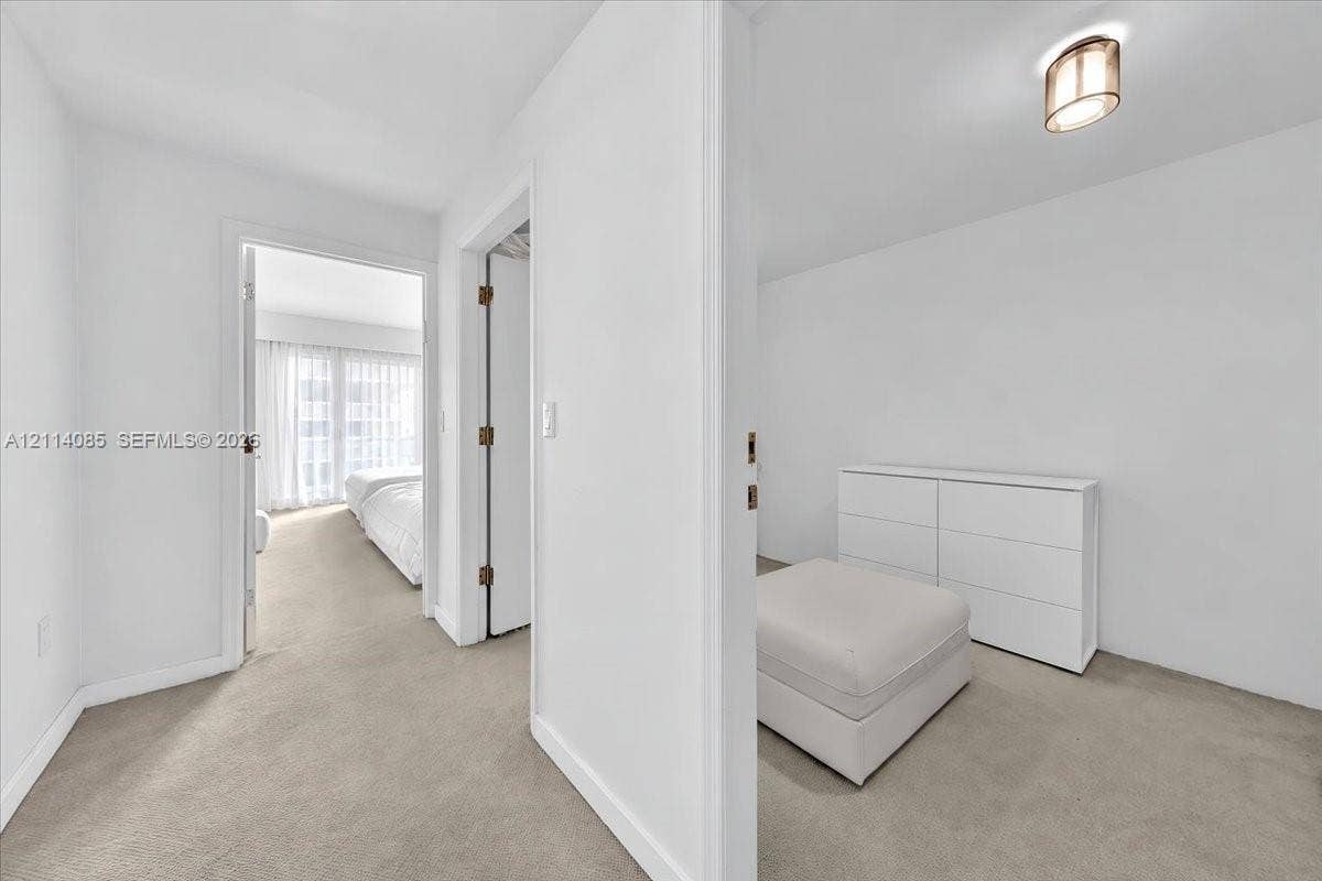 10101 Collins Avenue, #8D, Bal Harbour, FL 33154 Neutral-toned carpeting, ceiling-mounted dome lighting, and solid-core interior doors