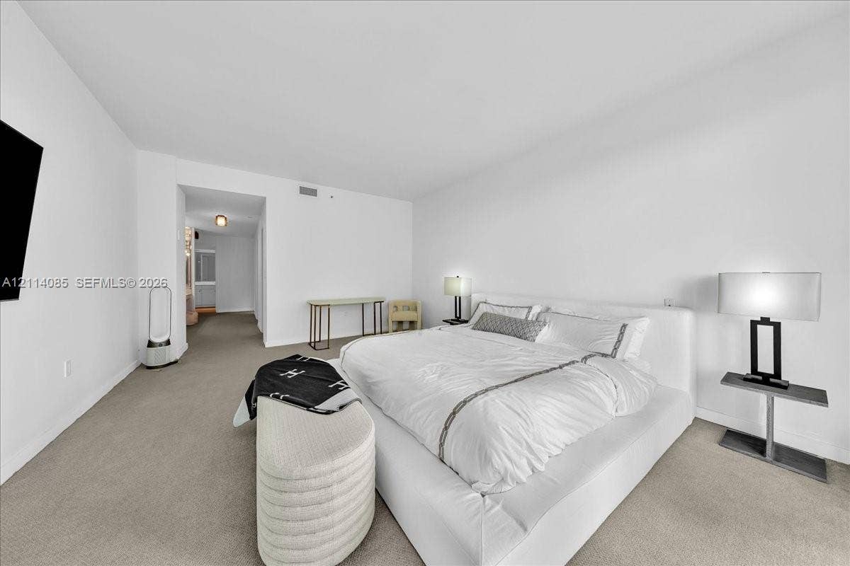 10101 Collins Avenue, #8D, Bal Harbour, FL 33154 Neutral-toned wall-to-wall carpeting and clean, white-painted wall finishes