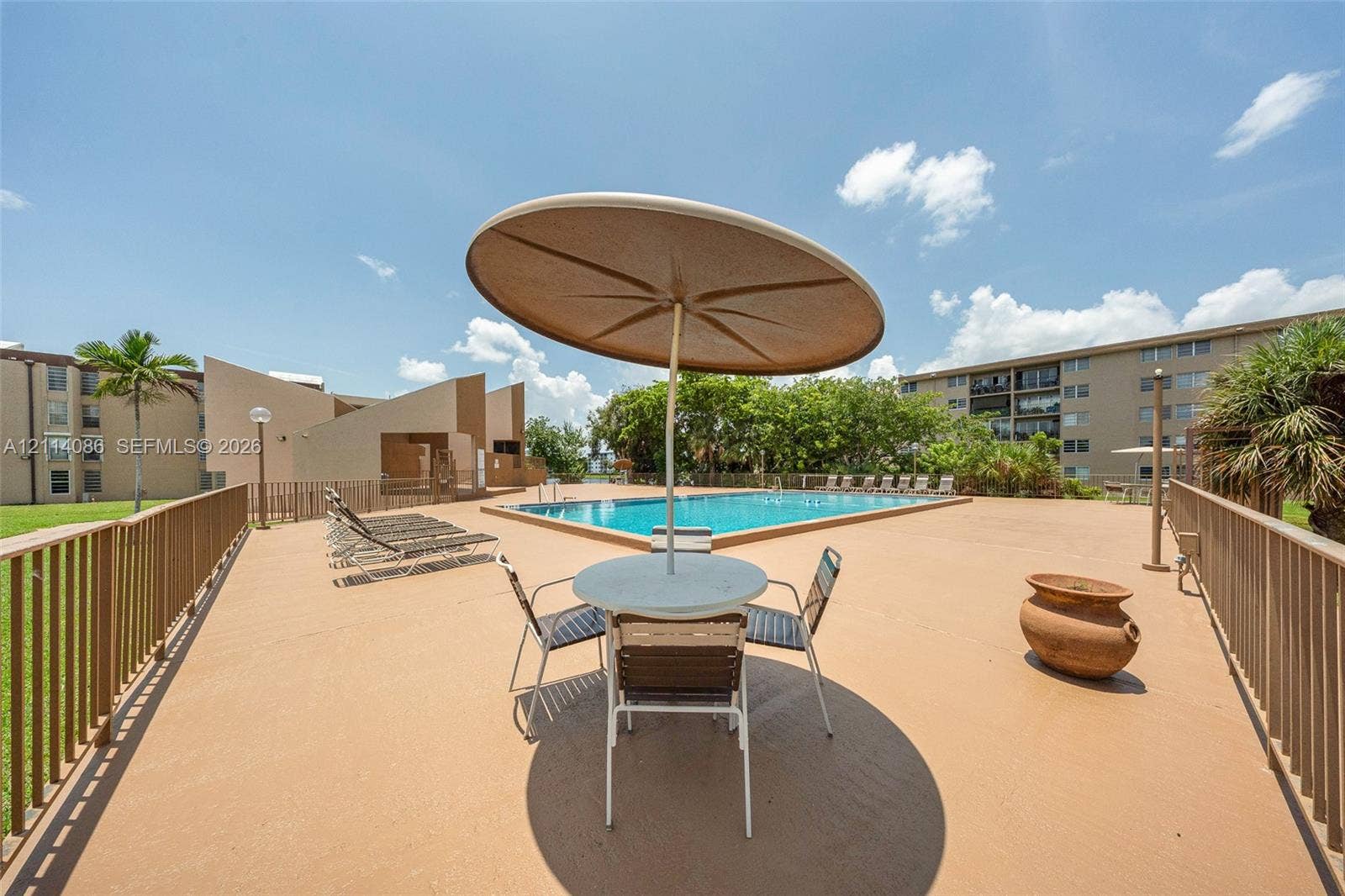 706 NW 87th Avenue, #204, Miami, Miami, FL 33172 Swimming pool with expansive concrete pool deck and metal perimeter fencing