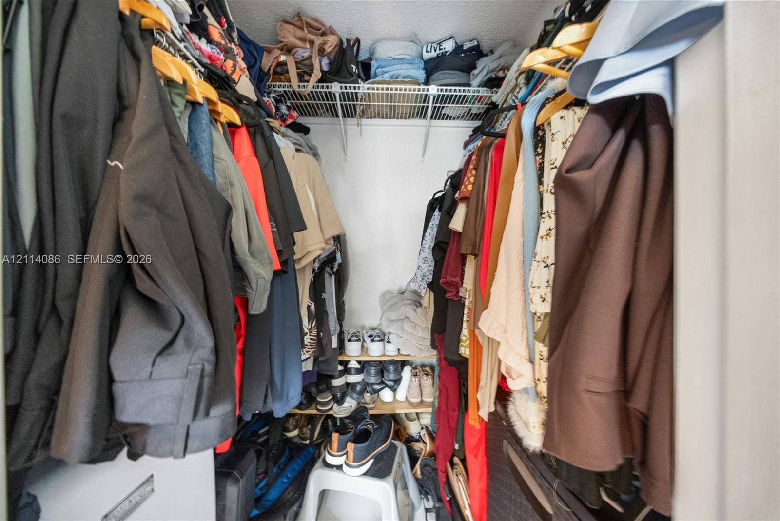 706 NW 87th Avenue, #204, Miami, Miami, FL 33172 Storage closet featuring wire shelving and tiered built-in shelving