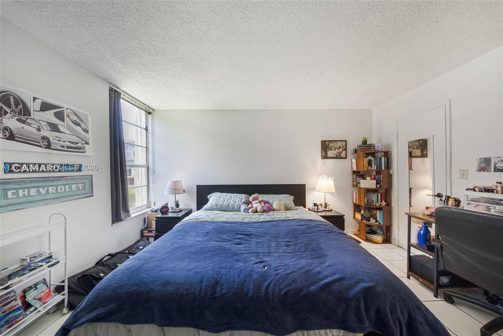 706 NW 87th Avenue, #204, Miami, Miami, FL 33172 Room featuring tile flooring and a vertical sliding window