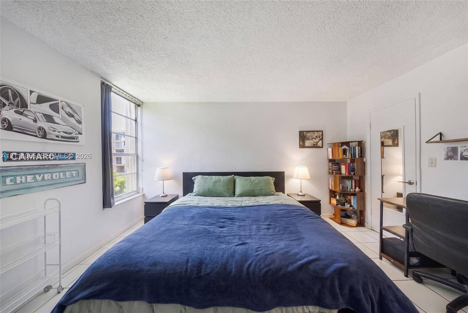 706 NW 87th Avenue, #204, Miami, Miami, FL 33172 Room featuring light-toned tile flooring, neutral wall paint, and a large multi-pane window